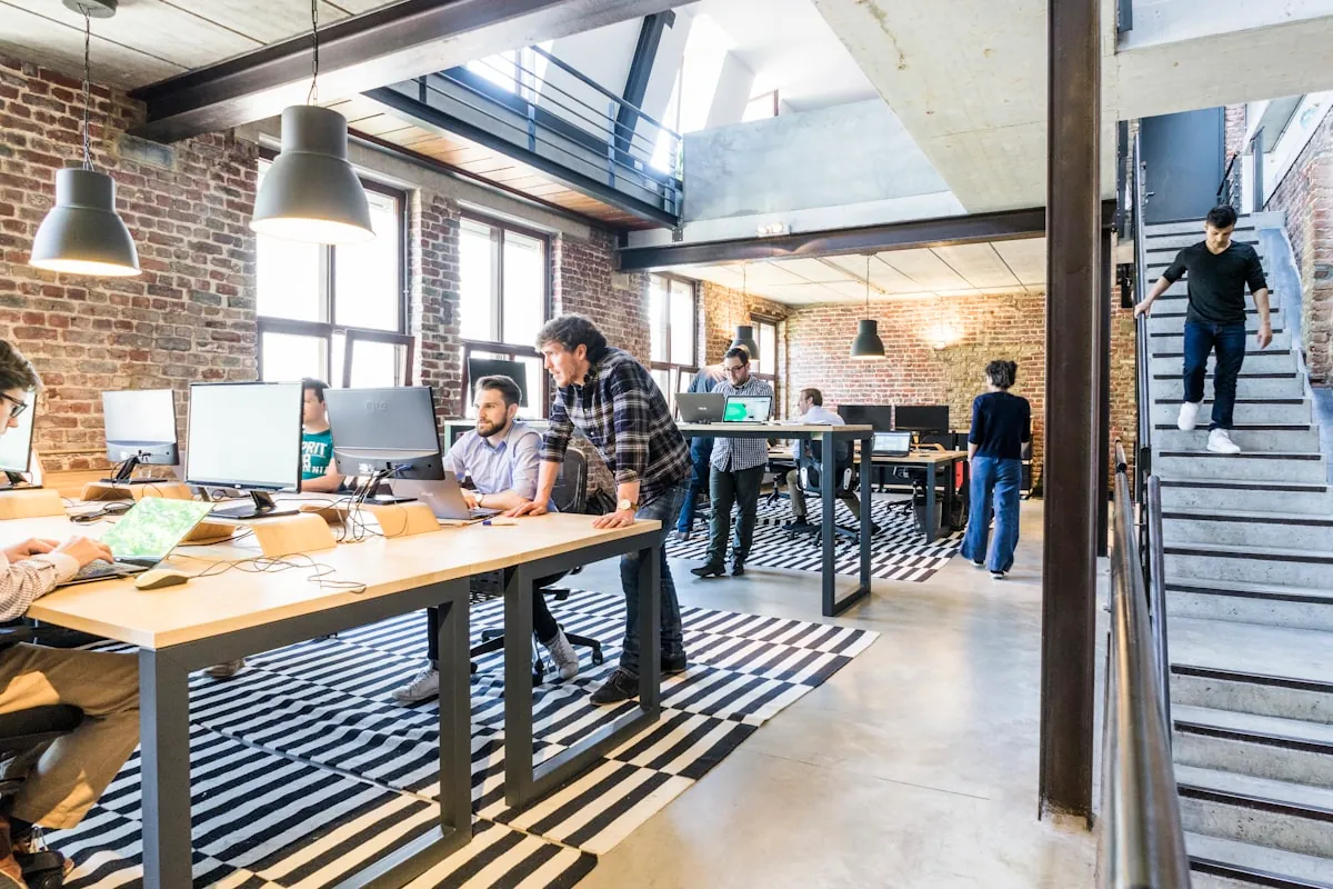 Business team collaborating in modern loft workspace